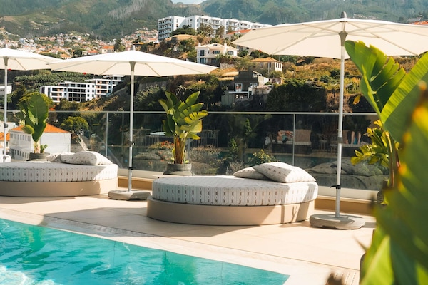 Indoor pool, outdoor pool, pool umbrellas, sun loungers