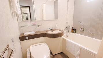 Combined shower/tub, free toiletries, hair dryer, slippers
