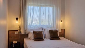 Standard Suite, Balcony | Living area | 32-inch TV with satellite channels