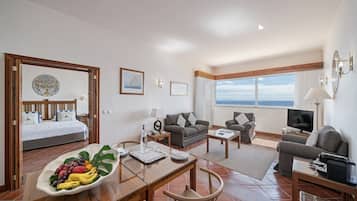 Superior Suite, Balcony, Sea View | Living area | 70-cm LED TV with cable channels, TV