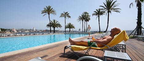 Indoor pool, pool umbrellas, pool loungers