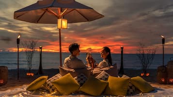 On the beach, sun-loungers, beach umbrellas, beach towels