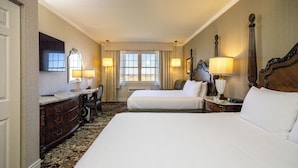 A hotel room with two beds, a dresser, a mirror, and a window with curtains. - AmishView Inn and Suites (Ronks)