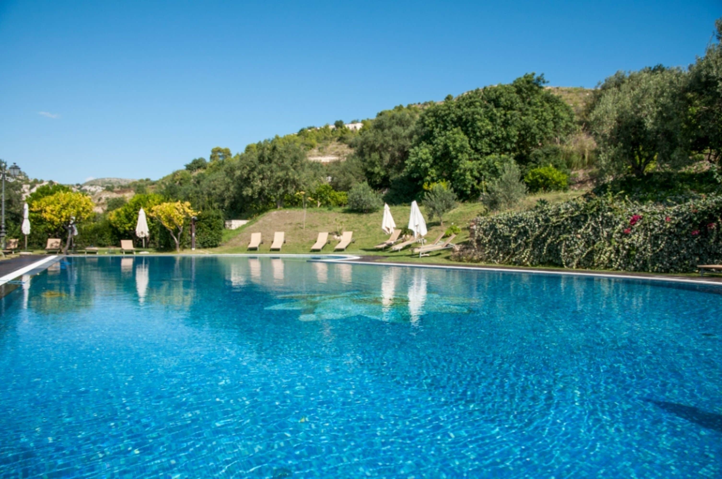Seasonal outdoor pool, pool umbrellas, sun loungers