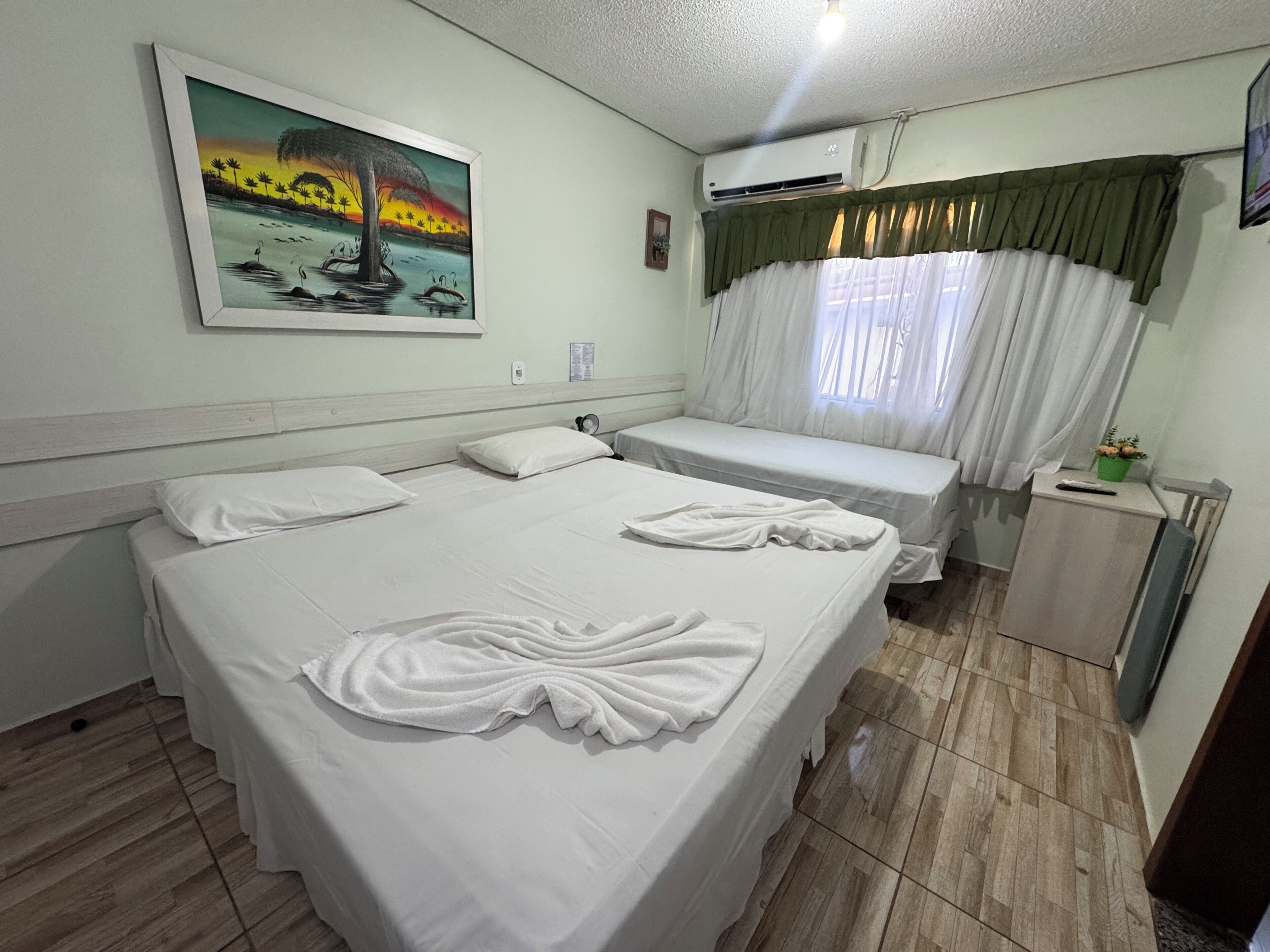 Triple Room | Minibar, in-room safe, desk, blackout drapes