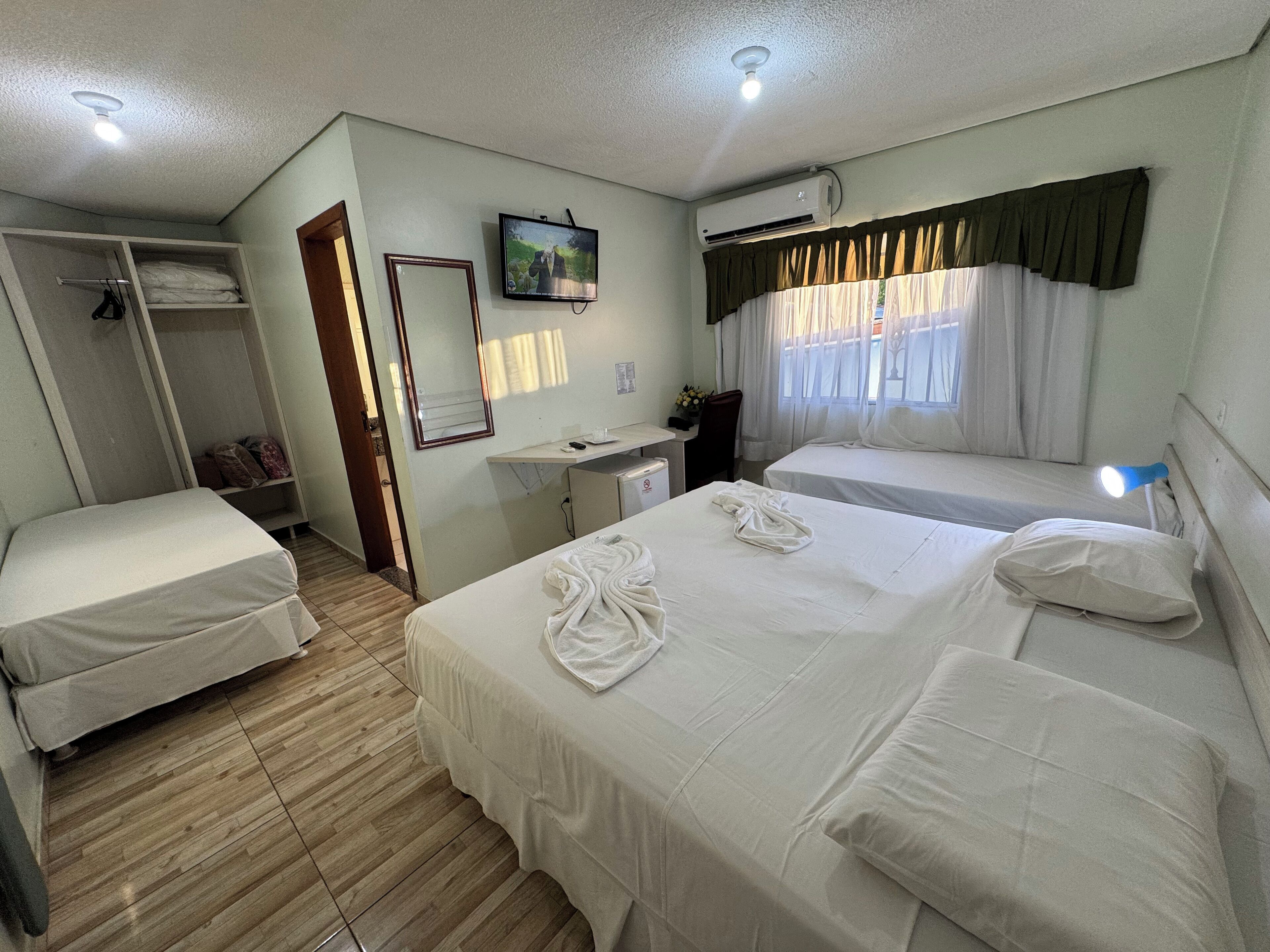 Quadruple Room | Minibar, in-room safe, desk, blackout drapes