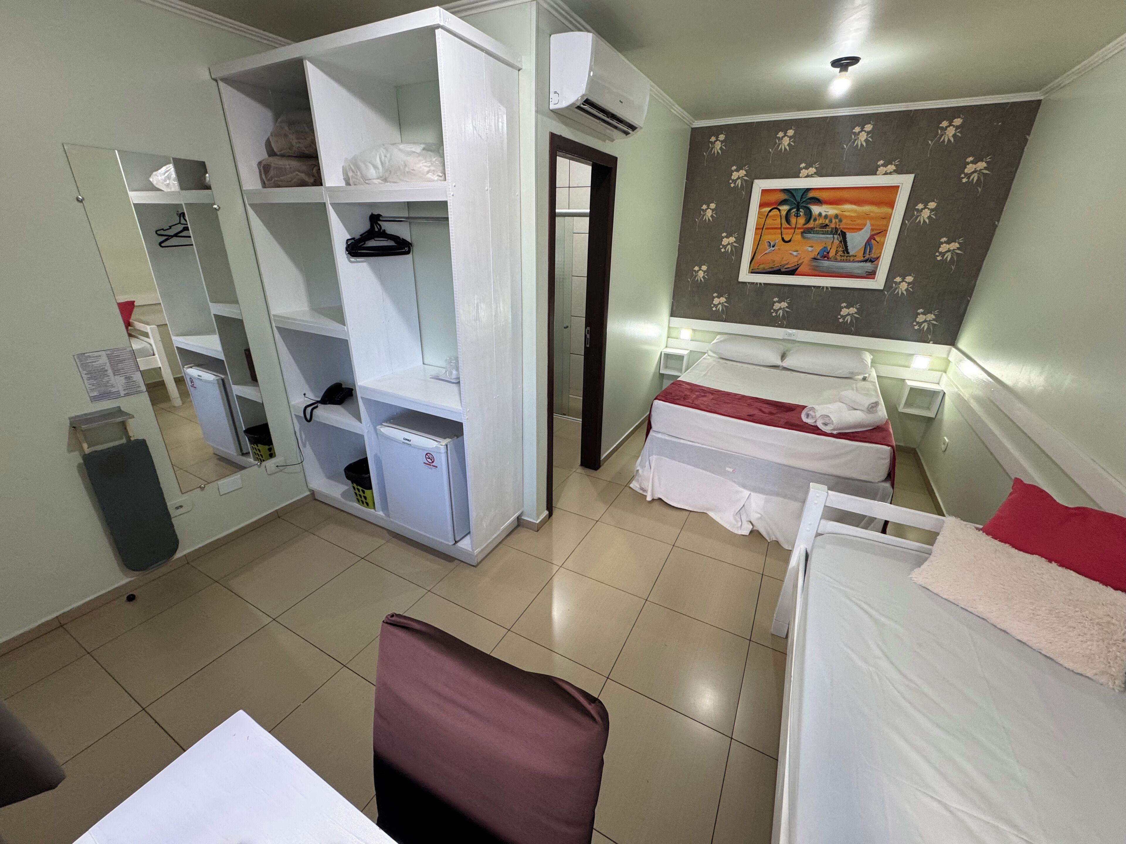 Deluxe Triple Room | Minibar, in-room safe, desk, blackout drapes