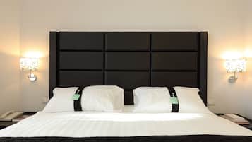 Ropa de cama de alta calidad, minibar, caja fuerte y escritorio