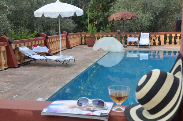 Outdoor pool, pool umbrellas, pool loungers