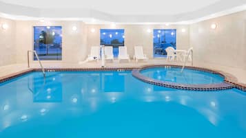 Indoor pool, open 7:00 AM to 10:00 PM, pool loungers