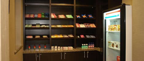 A snack bar with various packaged foods and beverages.