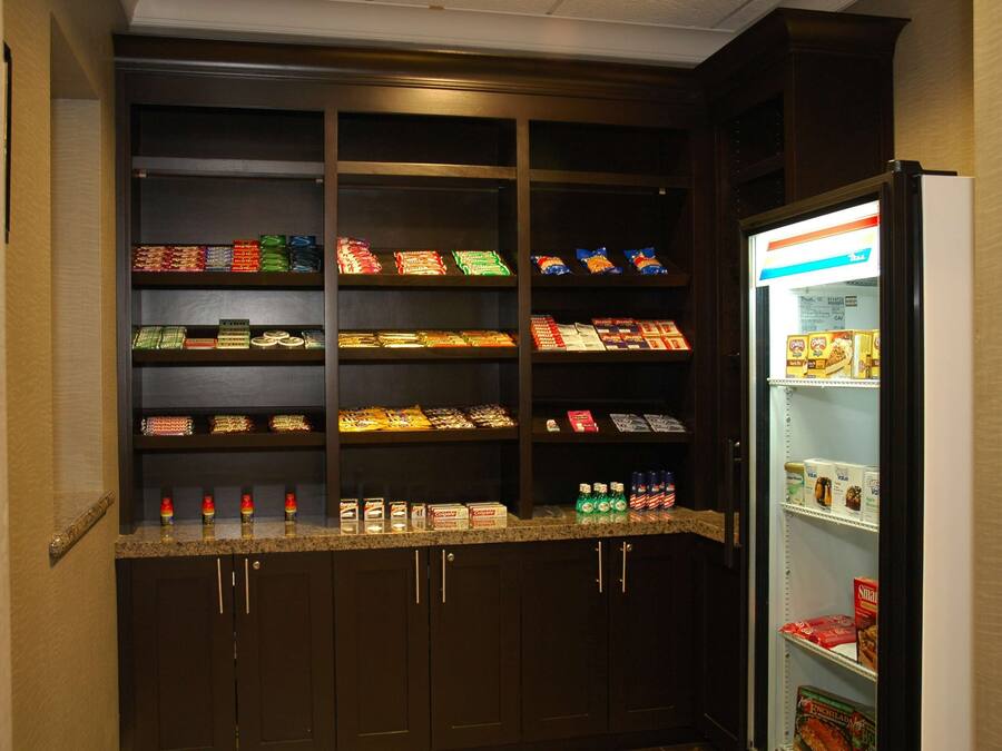 A snack bar with various packaged foods and beverages.