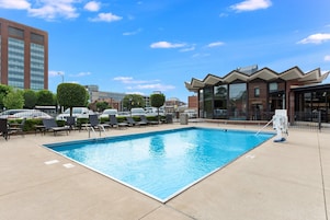 Seasonal outdoor pool, open 10:00 AM to 10:00 PM, pool umbrellas