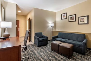 A fitness center with exercise equipment, a treadmill, dumbbells, and a water dispenser. at Comfort Suites West Memphis I-40 I-55
