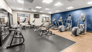 A gym with treadmills, elliptical machines, and weight equipment. - Hampton Inn & Suites Fairbanks (Fairbanks)