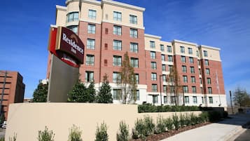 A multi-story hotel with a prominent sign for the Residence Inn Marriott.