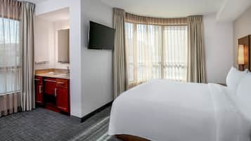 Premium bedding, pillow-top beds, desk, laptop workspace
