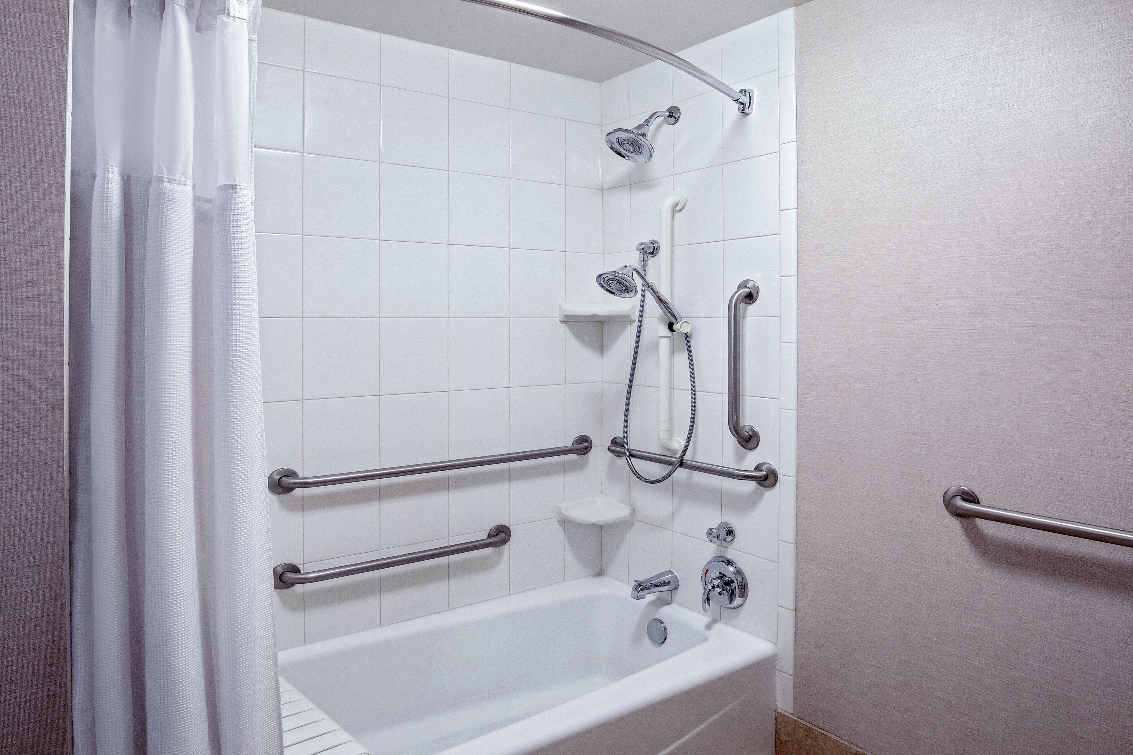 studio, 1 king bed with sofa bed (mobility accessible, tub) | bathroom | combined shower/bathtub, free toiletries, hair dryer, towels