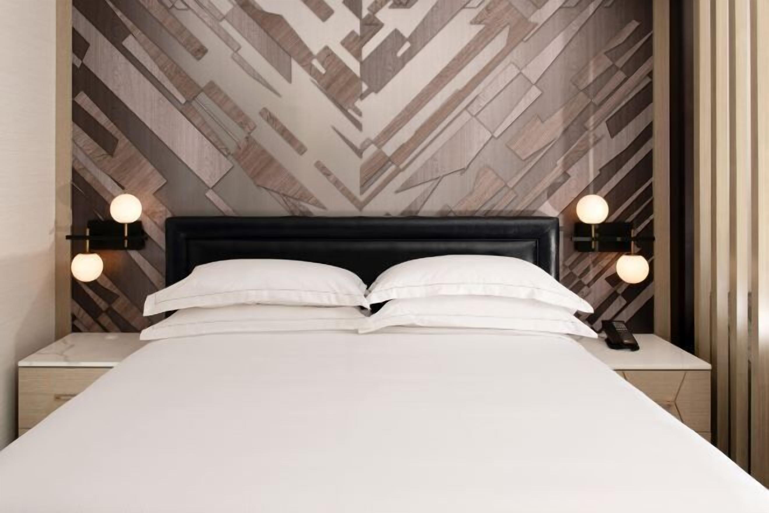 Premium bedding, down comforters, pillowtop beds, in-room safe