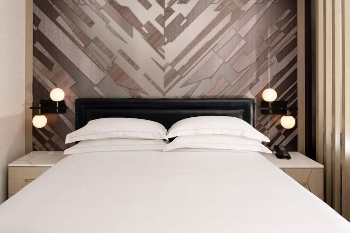 Premium bedding, down comforters, pillowtop beds, in-room safe