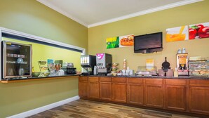 A breakfast bar with a coffee machine, a microwave, and a refrigerator. - Quality Inn DeRidder (DeRidder)
