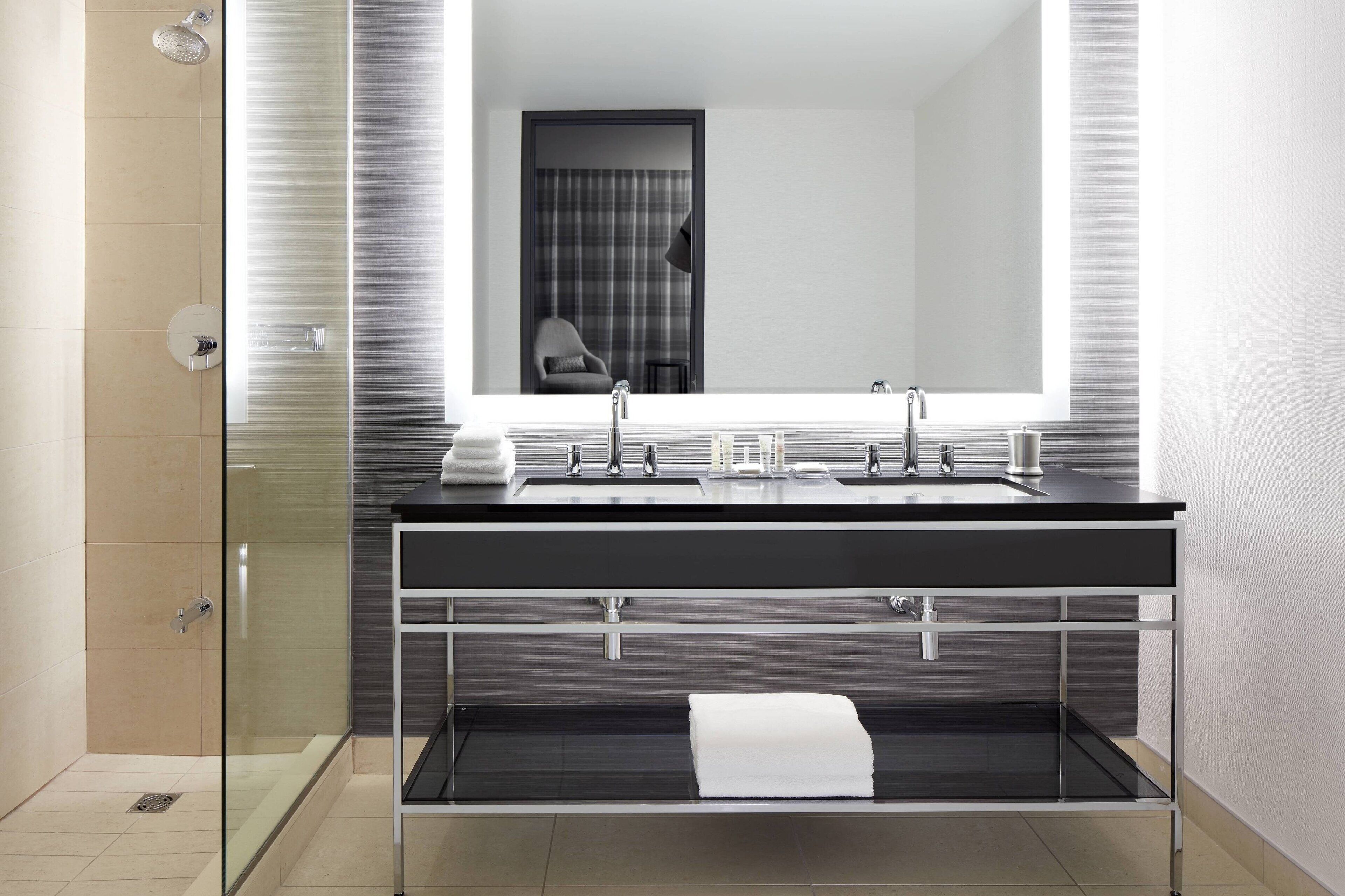 designer toiletries, hair dryer, bathrobes, towels