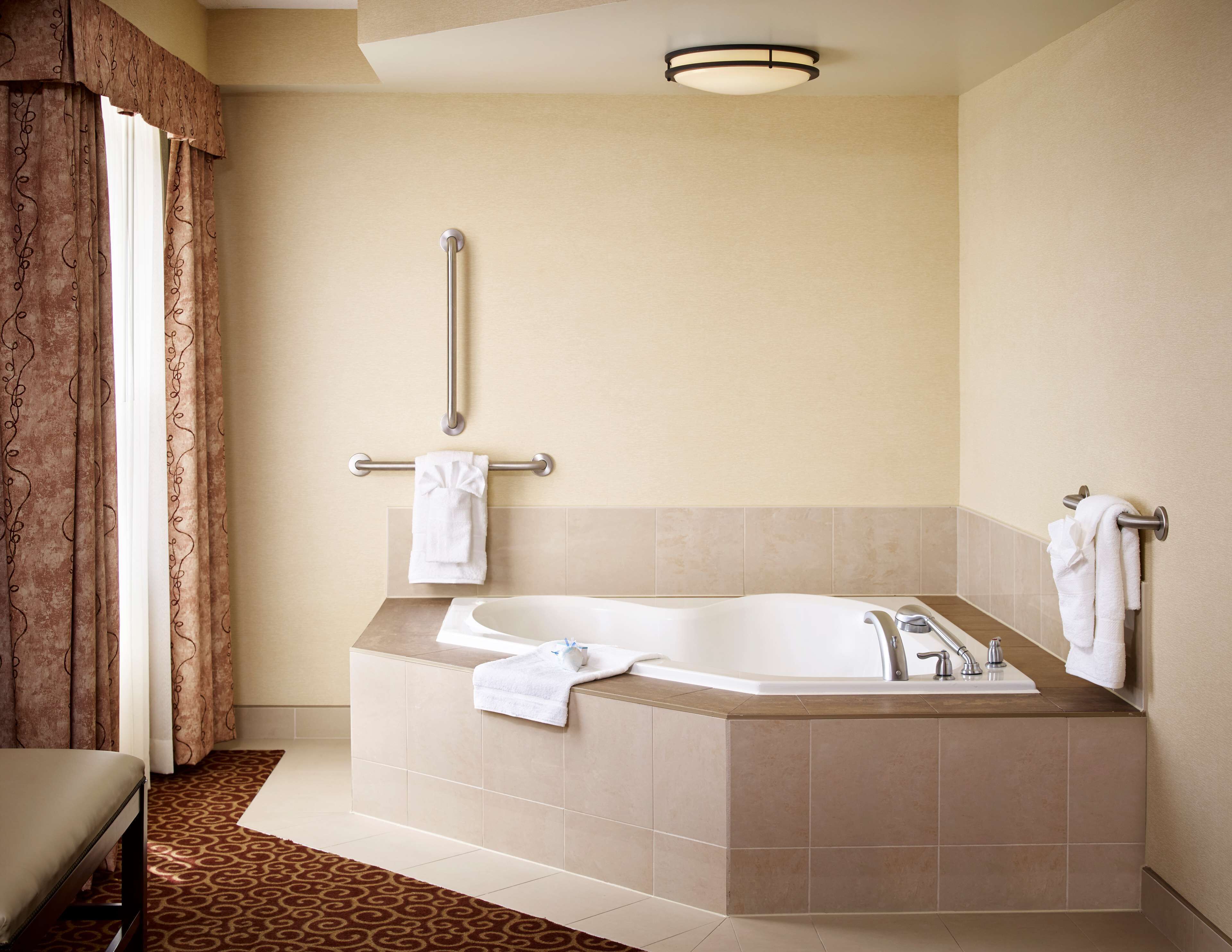 1 king corner whirlpool | bathroom | combined shower/bathtub, hair dryer, towels