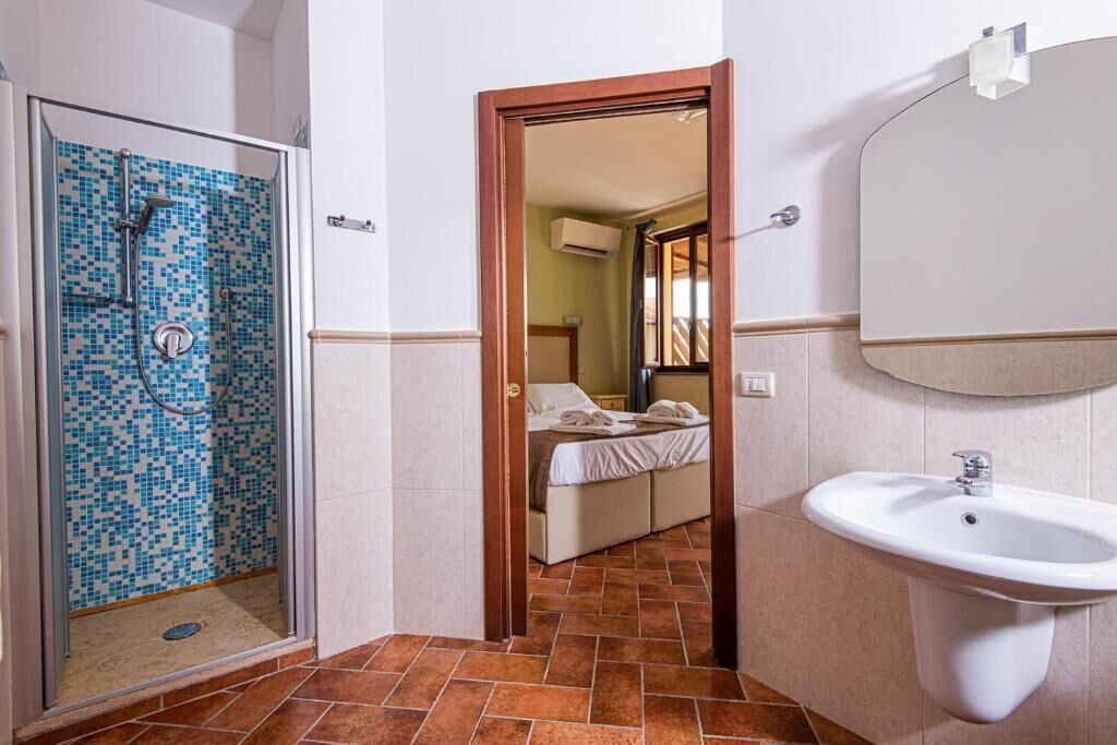 double room with patio | bathroom | rainfall showerhead, free toiletries, hair dryer, bidet