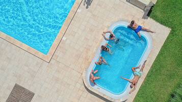 Seasonal outdoor pool, open 9:30 AM to 7:30 PM, pool umbrellas