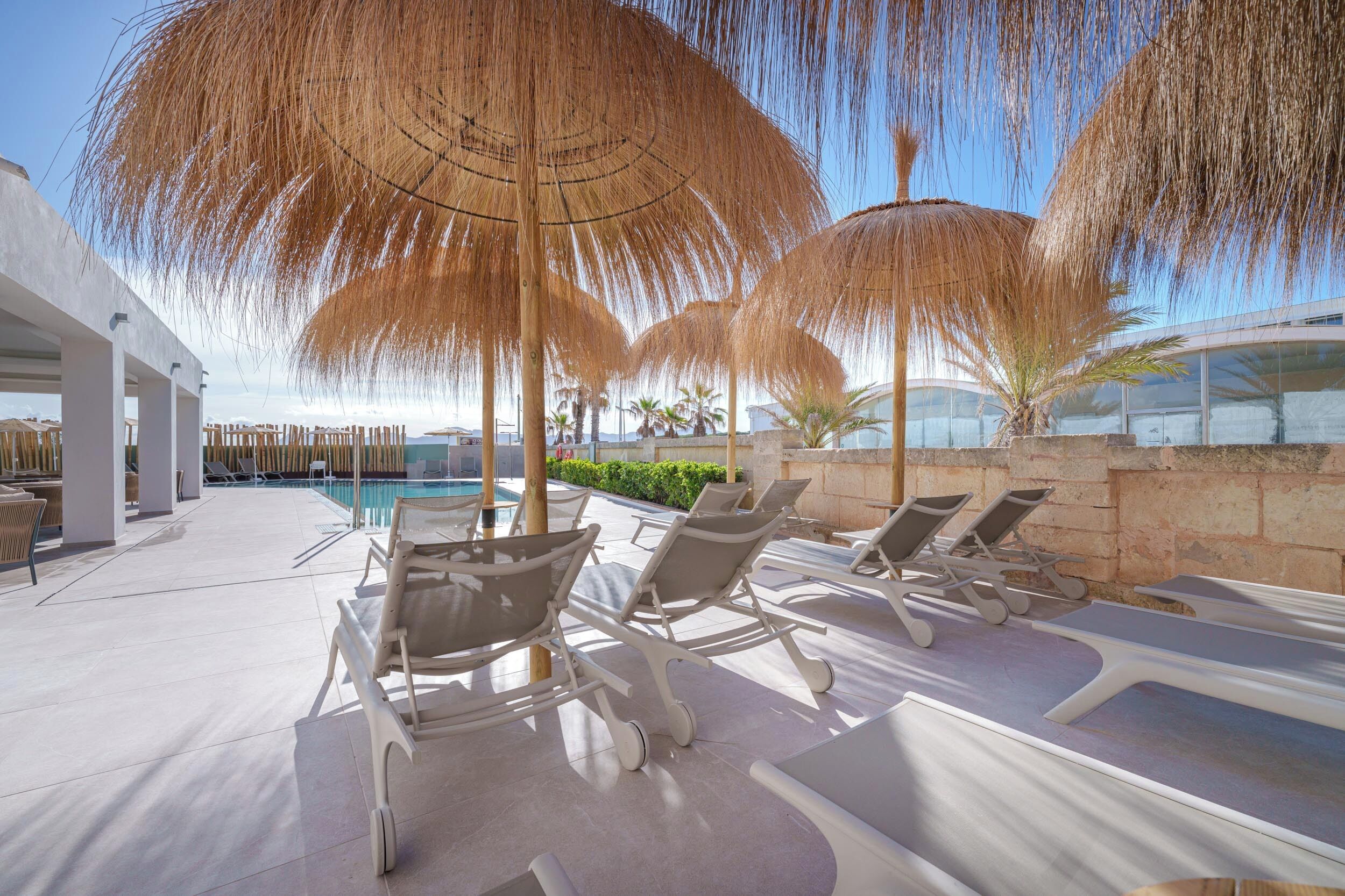 outdoor pool, pool loungers, lifeguards on site