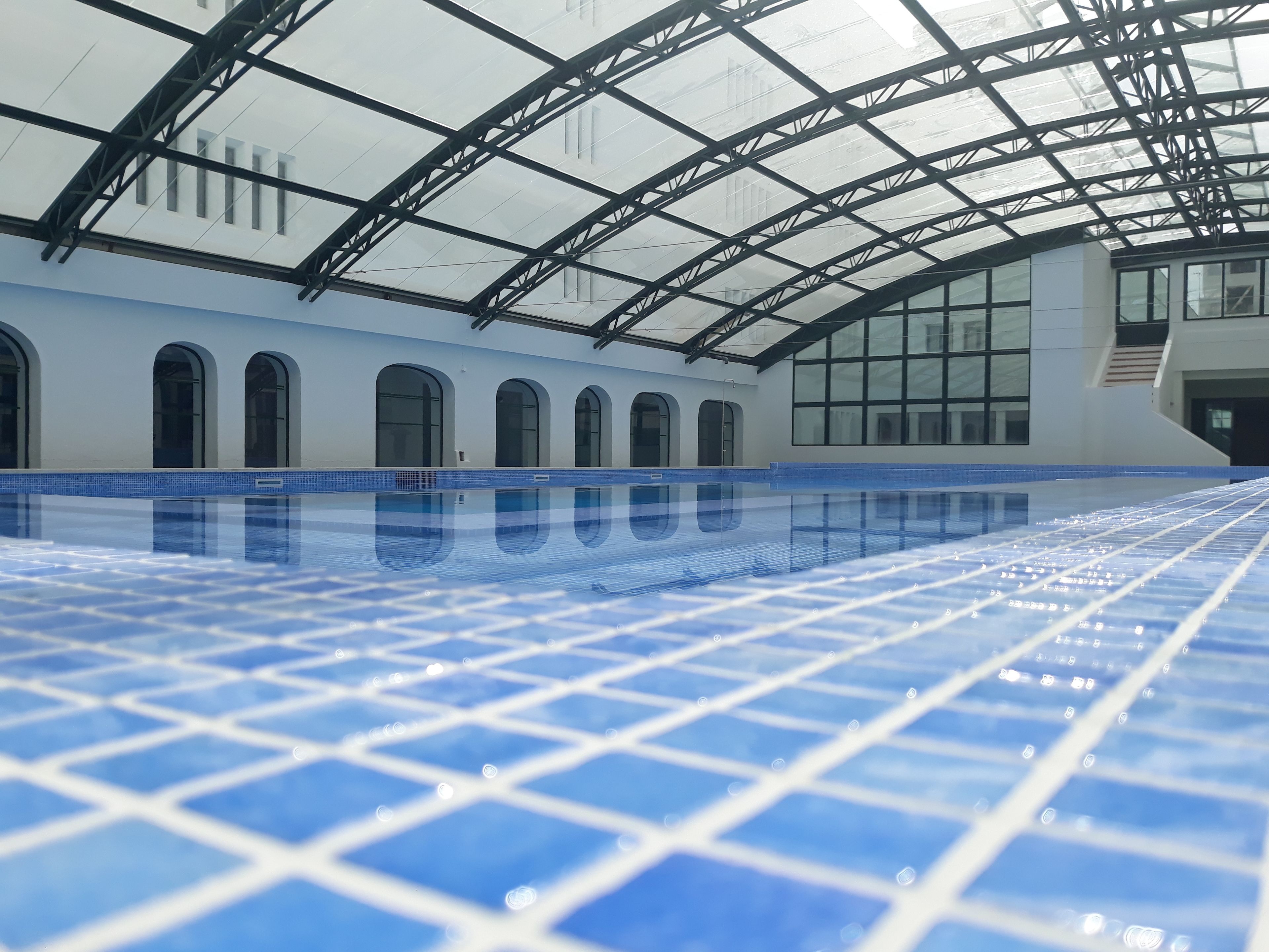 Indoor pool, open 8 AM to 8 PM, pool umbrellas, sun loungers
