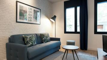 Standard Apartment, 1 Bedroom | Living area | LCD TV