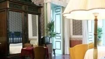 Deluxe Double Room | Living area | TV