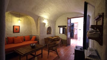 Standard House, 1 Bedroom (Cave) | Living area | TV, fireplace