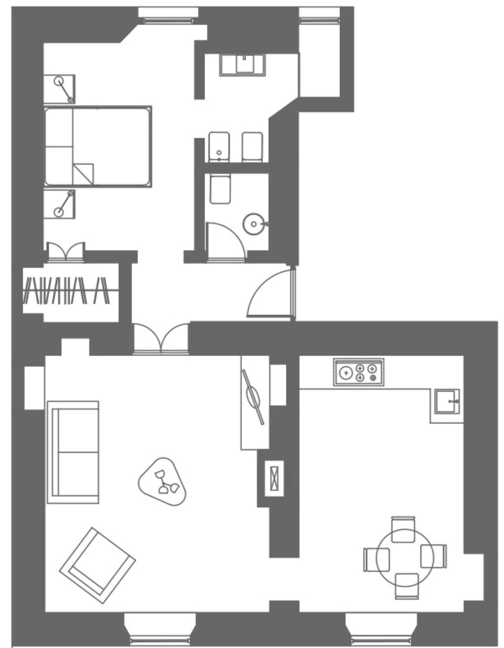 Een plattegrond met een keuken, eetgedeelte en twee slaapkamers.
