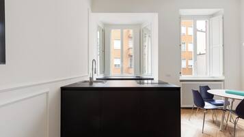 Full-sized fridge, stovetop, espresso maker, coffee/tea maker