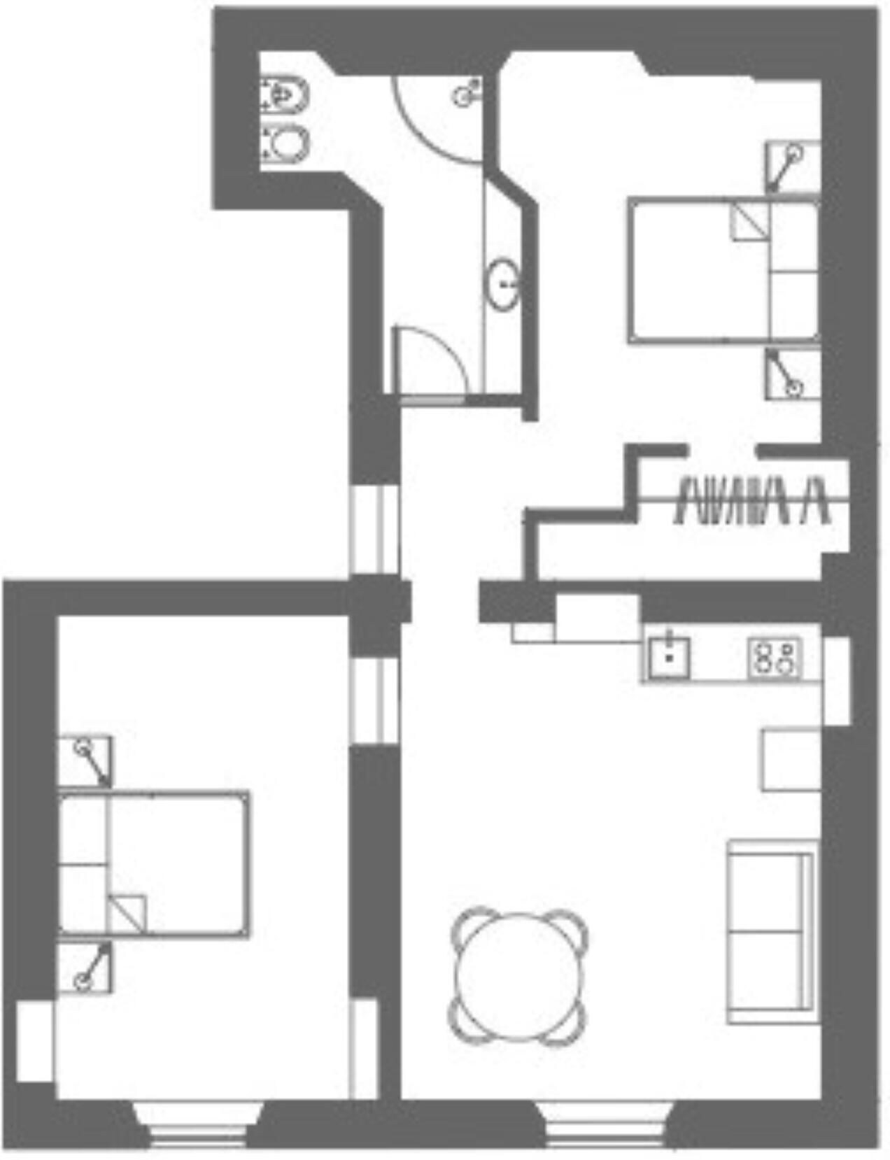 A floor plan with a kitchen, dining area, two bedrooms, and a bathroom.