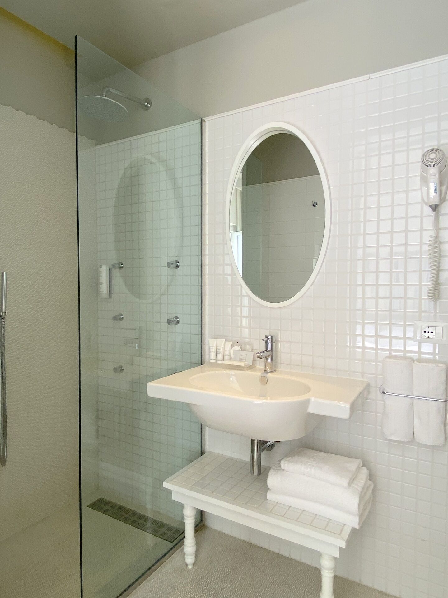 junior studio suite | bathroom | shower, rainfall showerhead, eco-friendly toiletries, hair dryer