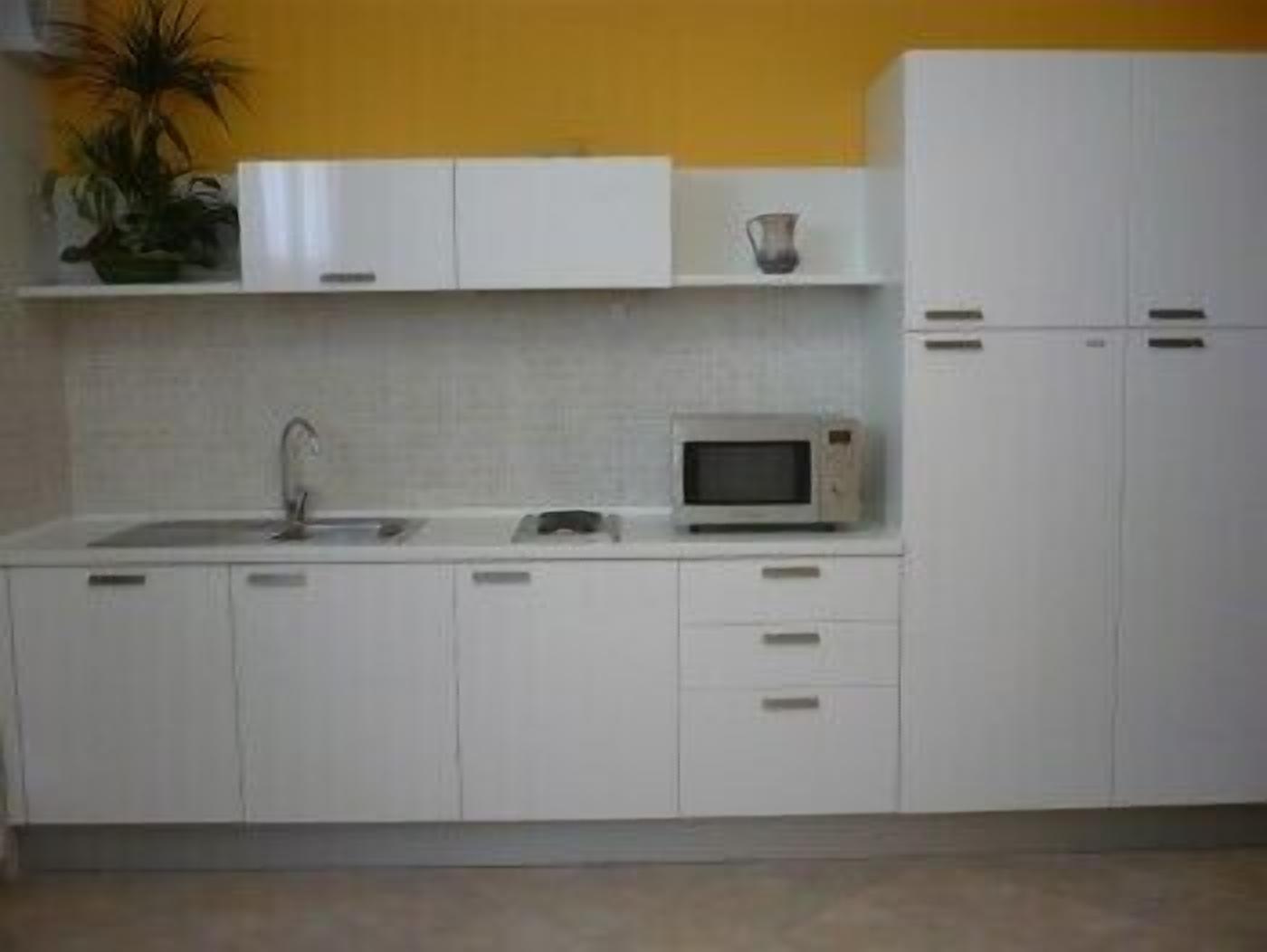 fridge, coffee/tea maker, cookware/dishes/utensils