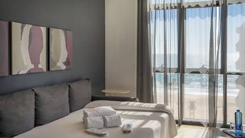 Apartment, 1 Bedroom, Sea View | 1 bedroom, down comforters, minibar, in-room safe
