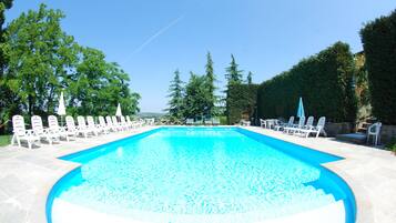 Seasonal outdoor pool, pool umbrellas, pool loungers