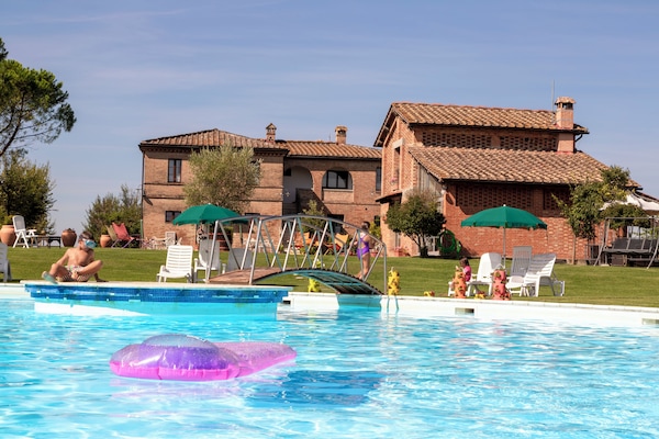 Seasonal outdoor pool, open 7:30 AM to 7:30 PM, pool umbrellas