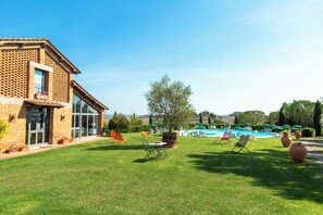Seasonal outdoor pool, open 7:30 AM to 7:30 PM, pool umbrellas