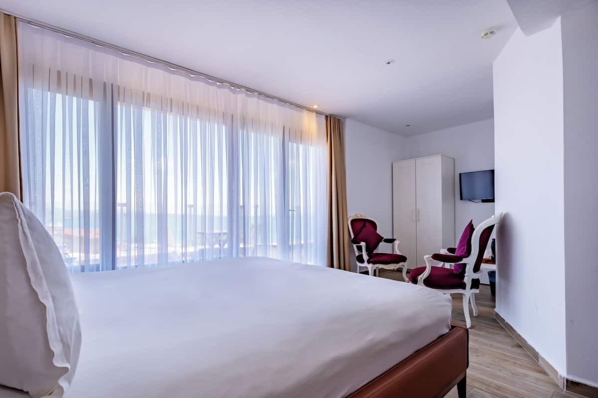 Deluxe Double Room, Sea View | Premium bedding, minibar, in-room safe, desk