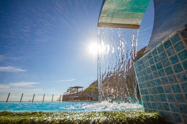 2 outdoor pools, open 9:00 AM to 9:00 PM, pool umbrellas, sun loungers