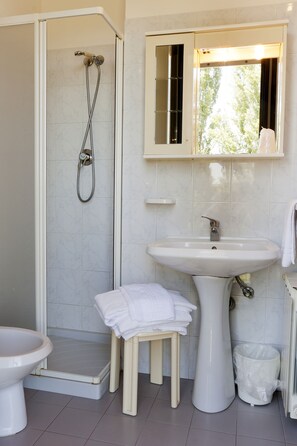 Shower, free toiletries, hair dryer, towels