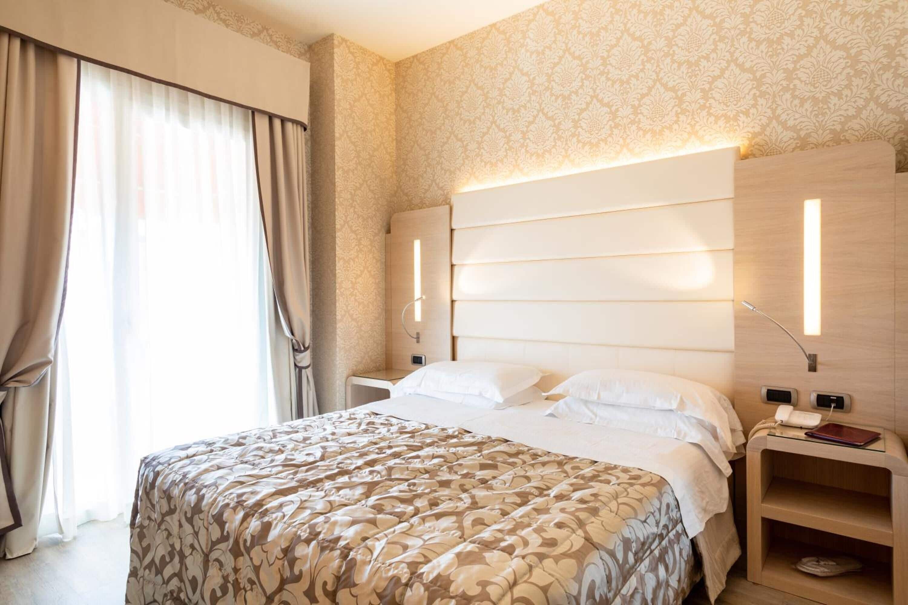 Classic Double Room, Balcony (Swimming pool side) | Minibar, in-room safe, desk, laptop workspace