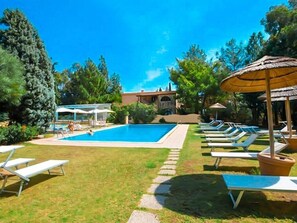 Seasonal outdoor pool, open 9:00 AM to 6:30 PM, pool umbrellas