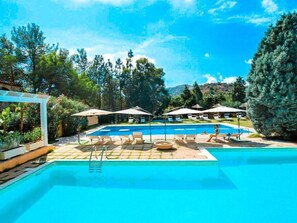 Seasonal outdoor pool, open 9:00 AM to 6:30 PM, pool umbrellas