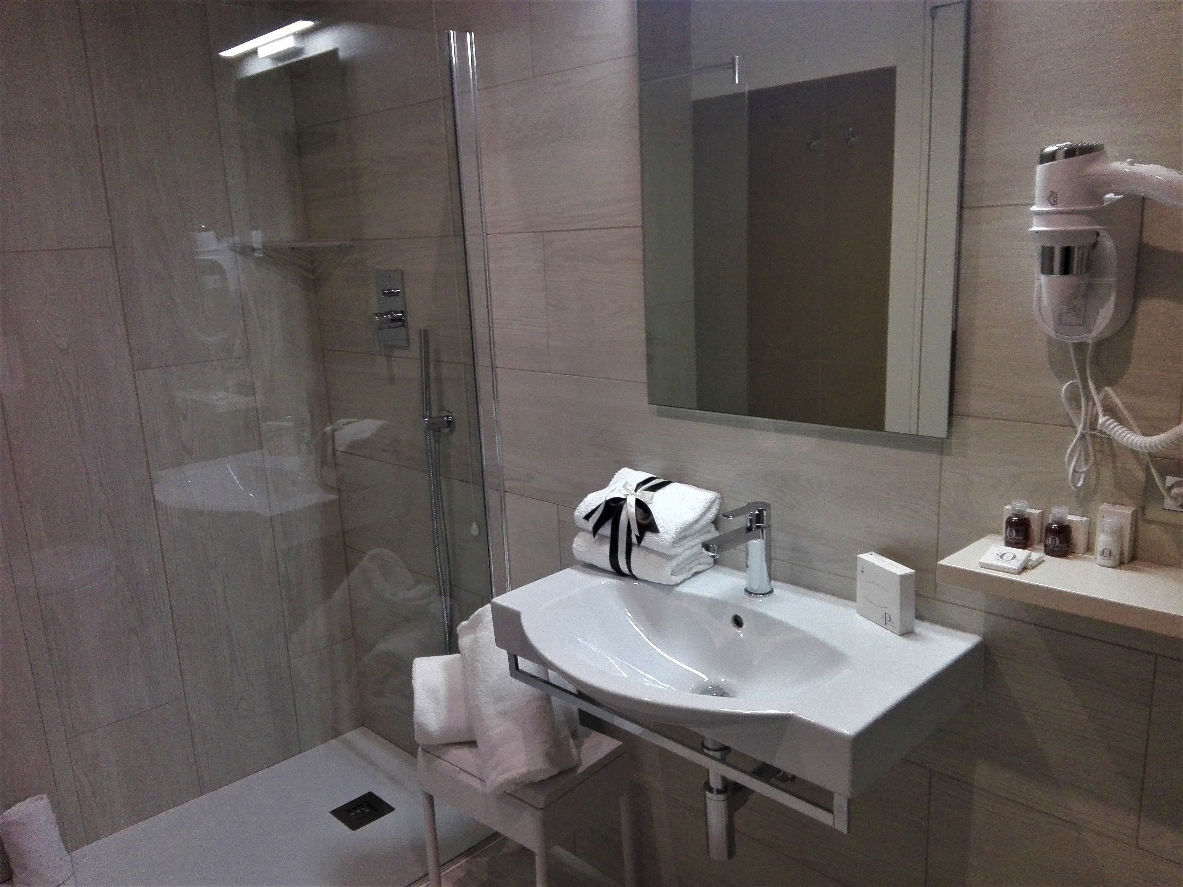 family quadruple room | bathroom | shower, rainfall showerhead, free toiletries, hair dryer